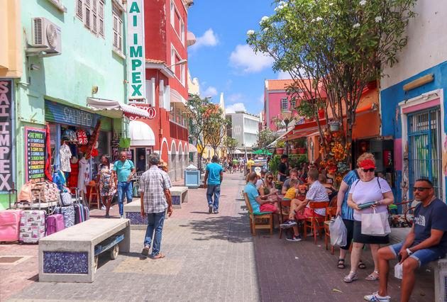 Busy shopping street with colorful commercial buildings in Willemstad, Curaçao