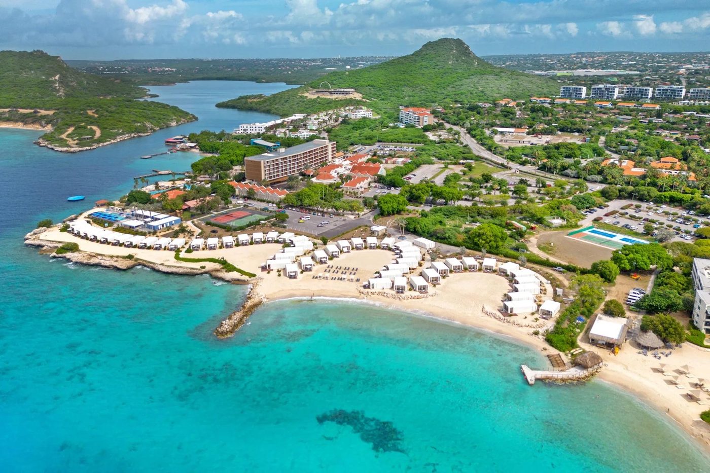 Aerial view of a luxury beachfront resort community on the Curaçao coast